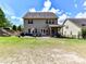 Expansive backyard with a patio, garden area, and lush green lawn for outdoor activities at 16404 Mckee Ridge Dr, Charlotte, NC 28278