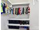 Well-organized closet with ample storage space, featuring shelving, clothing rods, and storage boxes at 16404 Mckee Ridge Dr, Charlotte, NC 28278