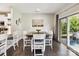 Dining area with modern table set and sliding glass doors to a patio at 16404 Mckee Ridge Dr, Charlotte, NC 28278