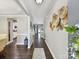 Elegant entryway with hardwood floors and decorative wall art, leading to various rooms at 16404 Mckee Ridge Dr, Charlotte, NC 28278
