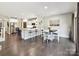 Open-concept kitchen with a dining area and stainless steel appliances at 16404 Mckee Ridge Dr, Charlotte, NC 28278