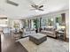 Open floor plan with living room, dining area, and kitchen with natural light at 16404 Mckee Ridge Dr, Charlotte, NC 28278