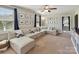Spacious living room with large sectional sofa, natural light, and tasteful decor for comfortable living at 16404 Mckee Ridge Dr, Charlotte, NC 28278
