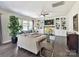 Spacious living room featuring large windows, a fireplace, and custom built-ins at 16404 Mckee Ridge Dr, Charlotte, NC 28278