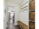 Inviting mudroom features custom bench with storage and stylish decor for a functional and organized entryway at 16404 Mckee Ridge Dr, Charlotte, NC 28278