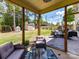 Relaxing patio with outdoor seating, a well-manicured lawn, and a cozy outdoor space at 16404 Mckee Ridge Dr, Charlotte, NC 28278