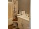 The bathroom features a tub with shower, toilet, vanity, and a lovely accent rug at 1906 Bromwich Rd # B, Charlotte, NC 28208