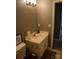 This bathroom features a functional vanity with a modern faucet and a toilet with neutral gray walls at 1906 Bromwich Rd # B, Charlotte, NC 28208