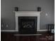 Elegant white fireplace mantel with decorative details, creating a cozy focal point at 1906 Bromwich Rd # B, Charlotte, NC 28208