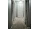 The hallway features neutral paint and carpet and several doorways, creating ease of movement at 1906 Bromwich Rd # B, Charlotte, NC 28208