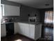 Open-concept kitchen with granite countertops, seamlessly blending with the living area at 1906 Bromwich Rd # B, Charlotte, NC 28208
