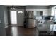 This eat-in kitchen features modern appliances, white cabinetry, and a neutral color scheme at 1906 Bromwich Rd # B, Charlotte, NC 28208
