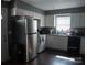 Functional kitchen with white cabinets and stainless steel refrigerator, offering practical storage solutions at 1906 Bromwich Rd # B, Charlotte, NC 28208