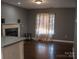 Comfortable living room area with a decorative fireplace, perfect for relaxation at 1906 Bromwich Rd # B, Charlotte, NC 28208