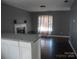 Open-concept living room with fireplace, modern paint, and ample natural light at 1906 Bromwich Rd # B, Charlotte, NC 28208