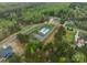 Aerial view of a community pool surrounded by lush green trees and single Gathering homes at 2125 Partridge Berry Ln, Rock Hill, SC 29730