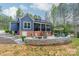 Backyard with a stone patio, fire pit, and seating at 2125 Partridge Berry Ln, Rock Hill, SC 29730