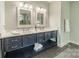Bathroom with dual vanity, framed mirrors, and elegant fixtures at 2125 Partridge Berry Ln, Rock Hill, SC 29730
