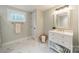 Bathroom featuring a vanity with a marble countertop and a framed mirror at 2125 Partridge Berry Ln, Rock Hill, SC 29730