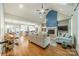 Open-concept living room featuring a fireplace, vaulted ceiling, and seamless flow to the kitchen at 2125 Partridge Berry Ln, Rock Hill, SC 29730