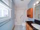 Cozy full bathroom with tub/shower, classic vanity, and storage cabinet for bathroom essentials at 2623 Shaw Ave, Gastonia, NC 28054