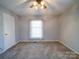 Carpeted bedroom offers a neutral color palette and ample closet space, ideal for relaxation and rest at 2623 Shaw Ave, Gastonia, NC 28054