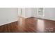 Bright bedroom featuring hardwood floors and natural light from two windows at 2623 Shaw Ave, Gastonia, NC 28054