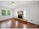 Cozy living room featuring a fireplace and hardwood floors at 2623 Shaw Ave, Gastonia, NC 28054