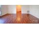 Inviting living room with beautiful wood floors and neutral paint, creating a warm and welcoming ambiance at 2623 Shaw Ave, Gastonia, NC 28054