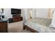 Cozy bedroom with decorative comforter, wood furnishings, and ample natural light at 3428 Orr St, Charlotte, NC 28269