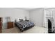 Bright bedroom with neutral walls and carpet, featuring two side tables and closet space at 3428 Orr St, Charlotte, NC 28269