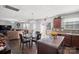 Open concept living space with wood flooring, abundant natural light, and cozy seating area at 3428 Orr St, Charlotte, NC 28269