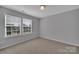 Bedroom with neutral carpet and paint and a window for natural light at 4928 Abendego Rd, Charlotte, NC 28213