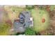 Birds eye view of a well-maintained home featuring a backyard deck and lush green lawn at 5125 Belicourt Dr, Charlotte, NC 28277