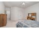 Bright bedroom with neutral walls, a ceiling fan, and built-in desk at 5125 Belicourt Dr, Charlotte, NC 28277