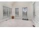 Bright bedroom with large windows and neutral carpet at 5125 Belicourt Dr, Charlotte, NC 28277