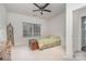 Cozy bedroom with neutral walls, a ceiling fan, and lots of natural light at 5125 Belicourt Dr, Charlotte, NC 28277