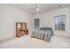 Spacious bedroom featuring a ceiling fan, neutral walls, and built-in desk at 5125 Belicourt Dr, Charlotte, NC 28277