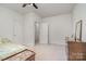 Bright bedroom featuring neutral walls, carpeted floors, and ample closet space at 5125 Belicourt Dr, Charlotte, NC 28277