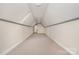 Large bonus room offers soft carpet, bright lighting and ample space for activities or storage at 5125 Belicourt Dr, Charlotte, NC 28277