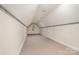 Spacious bonus room with neutral carpet and paint, featuring great natural light and ceiling fan at 5125 Belicourt Dr, Charlotte, NC 28277