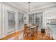 Cozy dining area with a chandelier, wood table, and adjacent kitchen space at 5125 Belicourt Dr, Charlotte, NC 28277