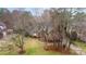 Charming brick home with mature landscaping and a well-manicured lawn at 5125 Belicourt Dr, Charlotte, NC 28277