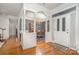 Elegant foyer with hardwood floors and dining room view at 5125 Belicourt Dr, Charlotte, NC 28277