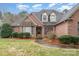 Charming brick home featuring a well-manicured front lawn at 5125 Belicourt Dr, Charlotte, NC 28277