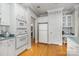 Bright kitchen featuring white appliances and an eat-in area with large windows at 5125 Belicourt Dr, Charlotte, NC 28277