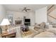 Spacious living room with a fireplace and comfortable seating at 5125 Belicourt Dr, Charlotte, NC 28277