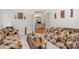 Cozy living room featuring view of a sunroom through French doors at 5125 Belicourt Dr, Charlotte, NC 28277