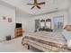 Spacious main bedroom featuring a tray ceiling, large windows, and walk-in closet at 5125 Belicourt Dr, Charlotte, NC 28277