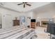 Spacious main bedroom featuring a fireplace, ceiling fan, and ensuite bathroom for ultimate comfort at 5125 Belicourt Dr, Charlotte, NC 28277